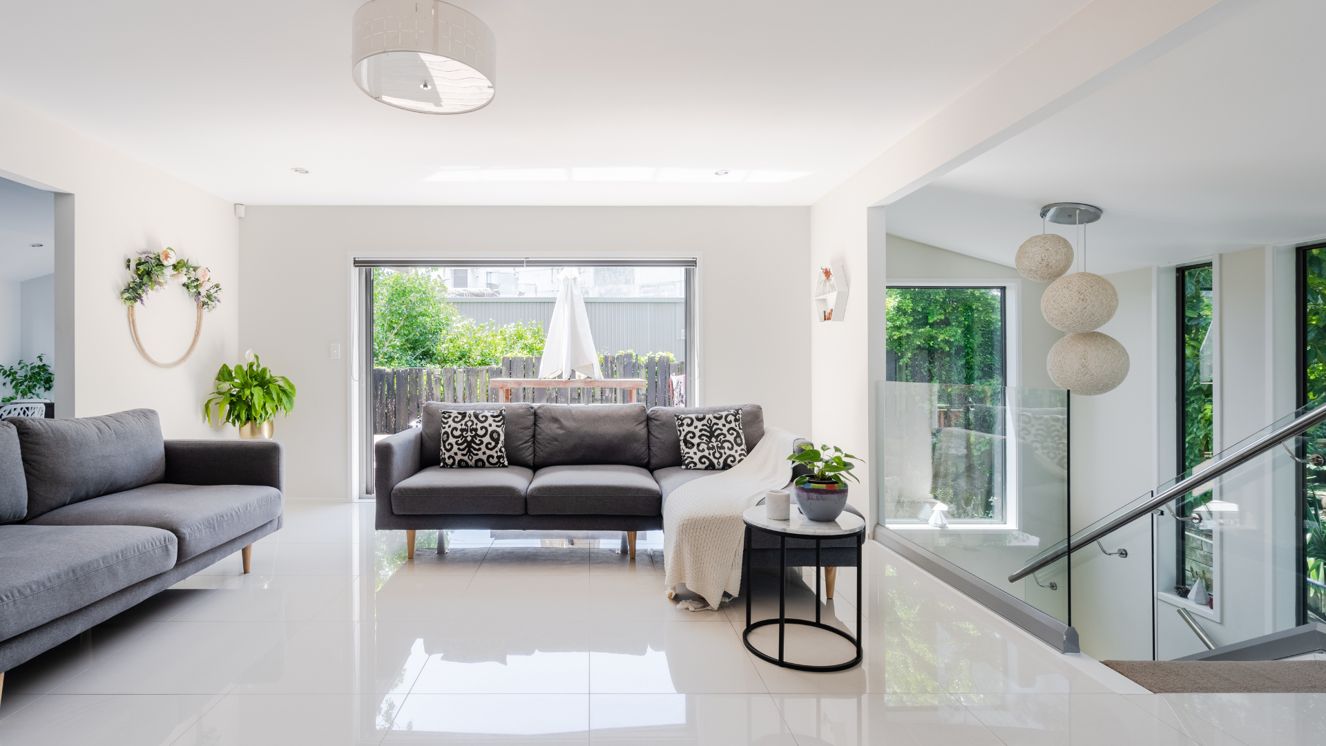 Bright, modern office with many green plants